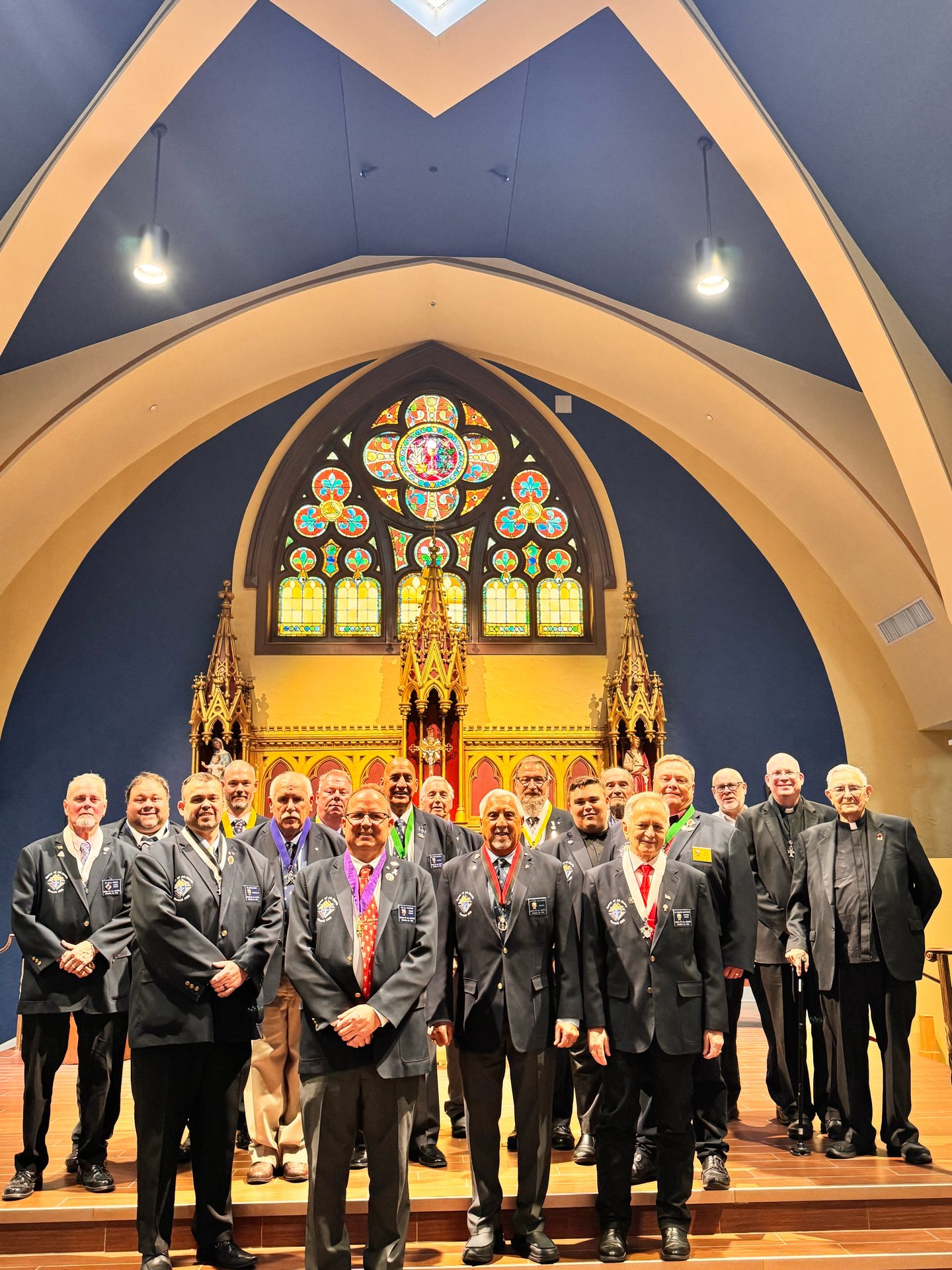 Officers and clergy of Queen of All Hearts Council 4126 gathered at the altar of St. John the Evangelist after the Officer Installation on September 20, 2026