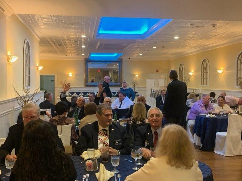 Wide view of the Officer Installation dinner with Knights and guests gathered in fellowship