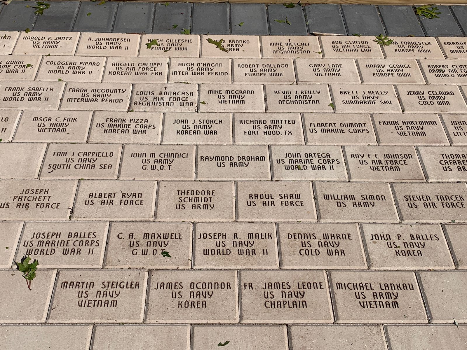 Rows of engraved memorial bricks honoring veterans in the prayer garden